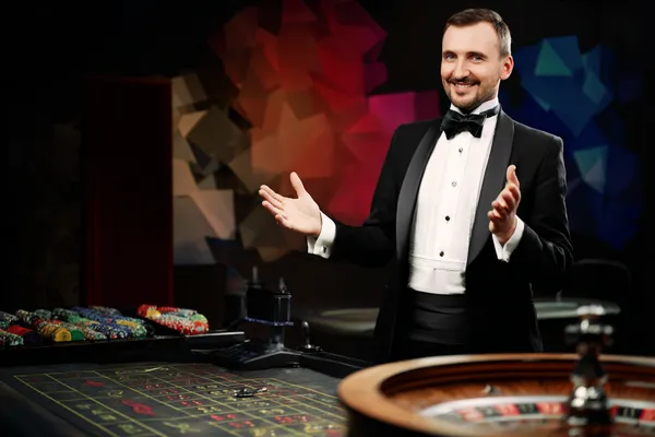 A glowing roulette wheel with cascading chips, symbolizing the engaging live and instant-win games available on GOOD11111.